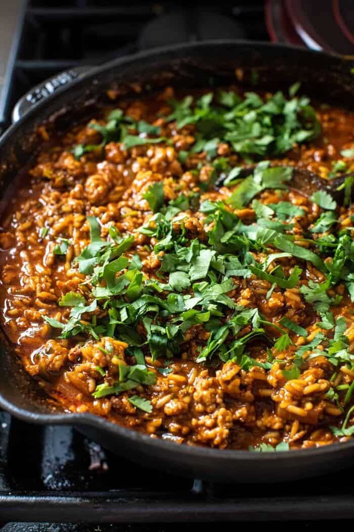 prep photo of skillet with meat and sauce before adding the chips