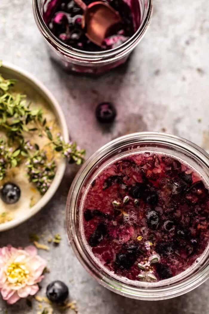 Blueberry Lemon Thyme Smash | halfbakedharvest.com overhead prep photo of Blueberry Lemon Thyme Smash in glass jar