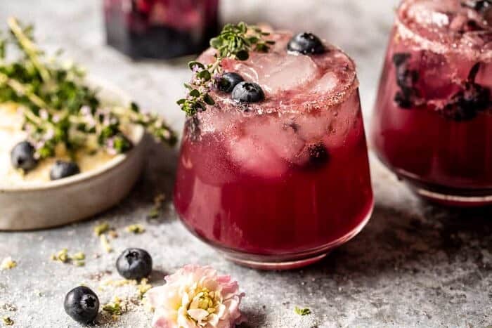 Blueberry Lemon Thyme Smash | halfbakedharvest.com side angle horizontal photo of Blueberry Lemon Thyme Smash