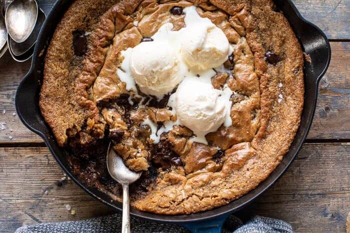 overhead horizontal photo of Crinkle Top Chocolate Peanut Butter Skillet Blondies with spoon in skillet
