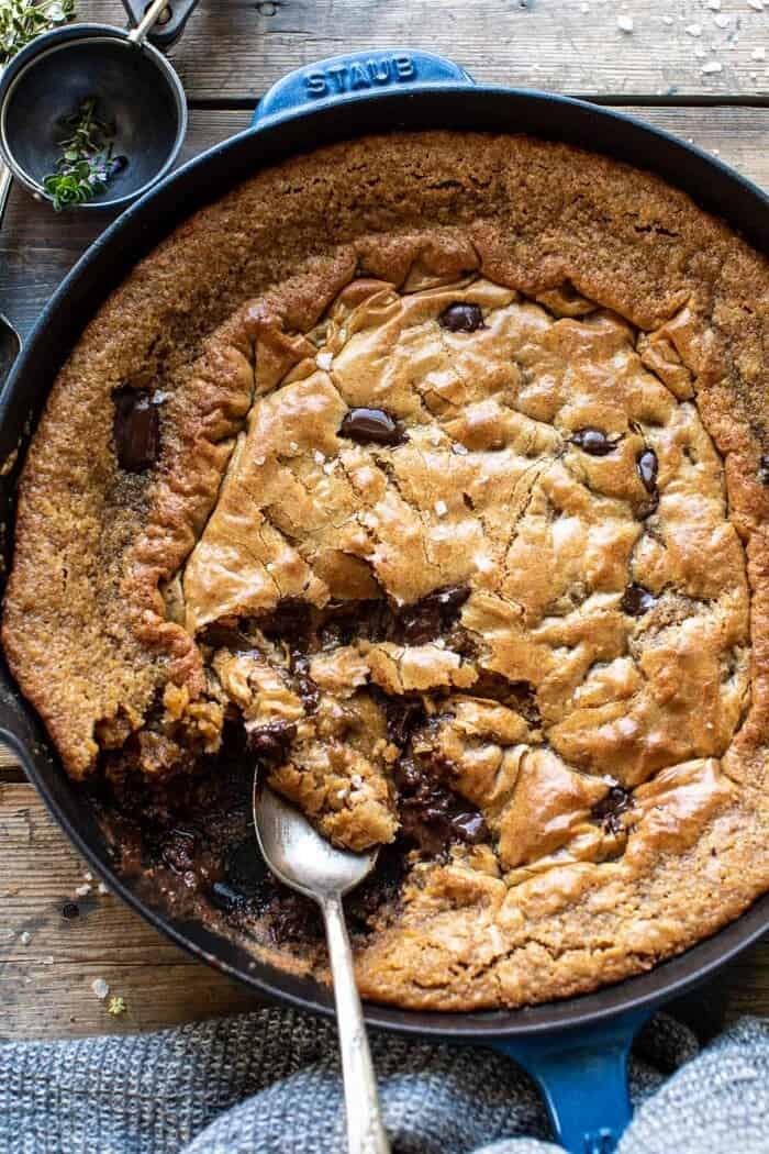 overhead close up photo of Crinkle Top Chocolate Peanut Butter Skillet Blondies with spoon in skillet