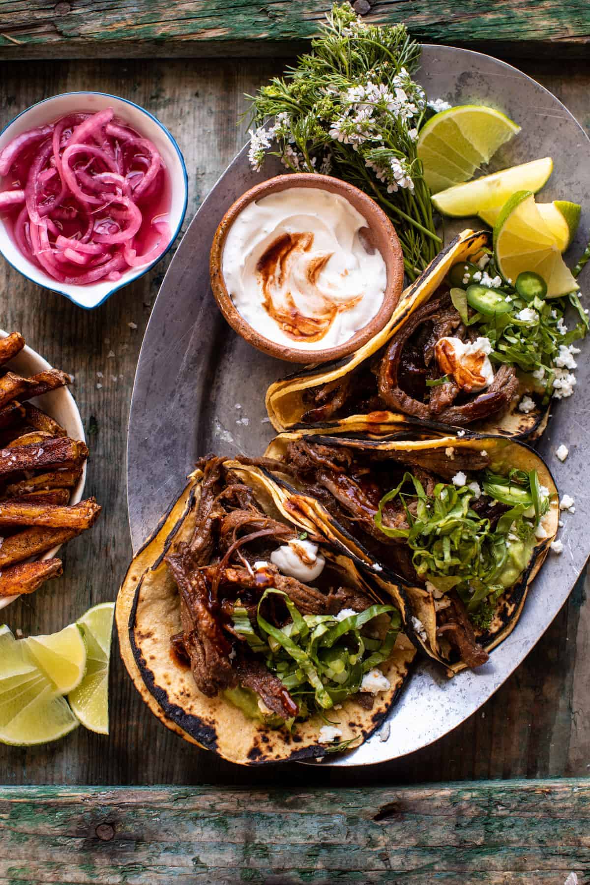 Crockpot Carne Asada Tacos with Cilantro Lime Garlic Sauce | halfbakedharvest.com