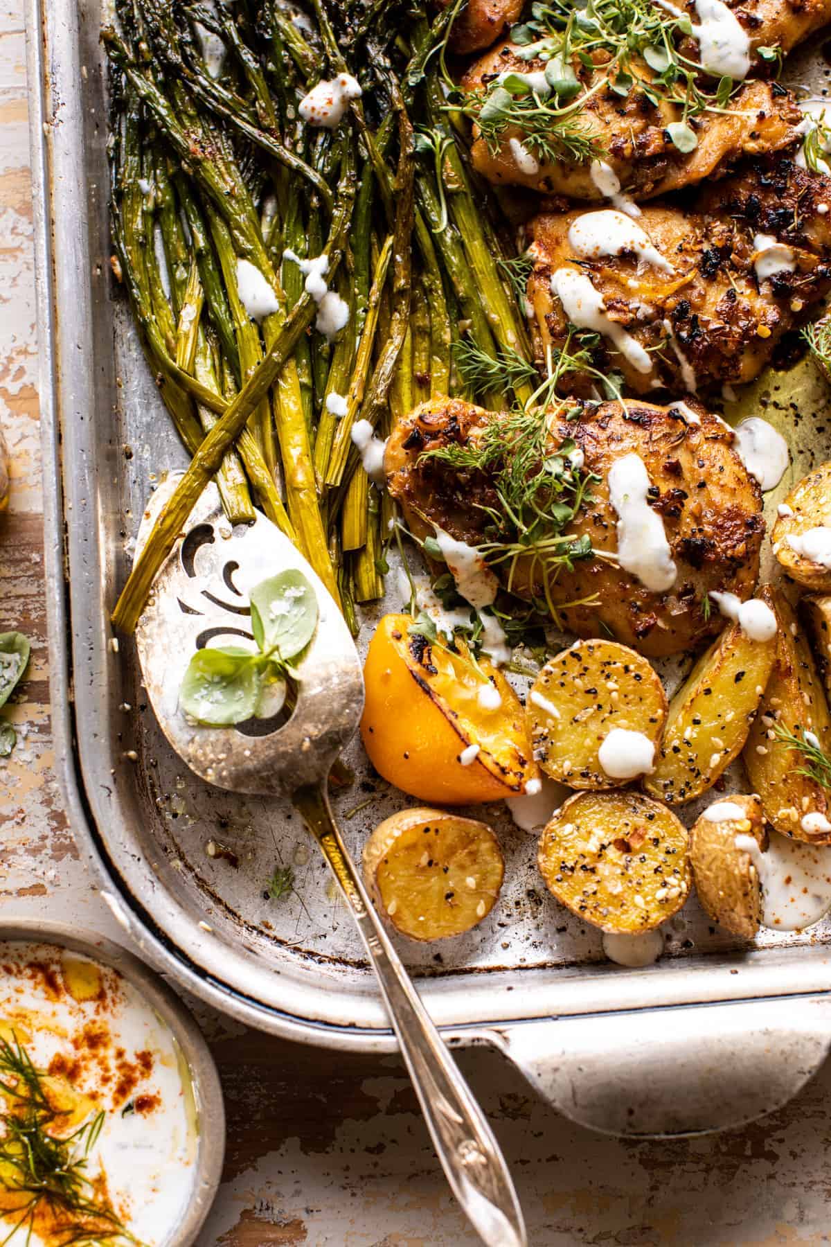 Sheet Pan Lemon Rosemary Dijon Chicken and Potatoes with Feta Goddess Sauce | halfbakedharvest.com