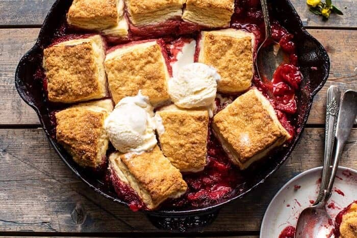 Skillet Strawberry Bourbon Cobbler with Layered Cream Cheese Biscuits | halfbakedharvest.com overhead horizontal photo of Skillet Strawberry Bourbon Cobbler with Layered Cream Cheese Biscuits