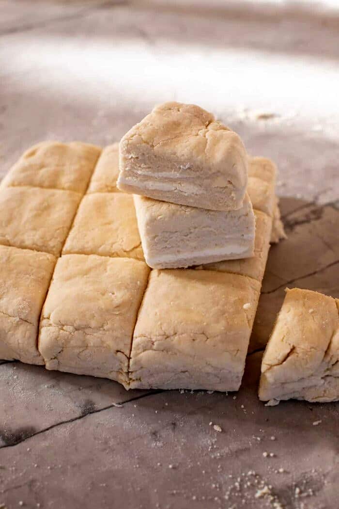 Skillet Strawberry Bourbon Cobbler with Layered Cream Cheese Biscuits | halfbakedharvest.com prep photo of Layered Cream Cheese Biscuits before baking