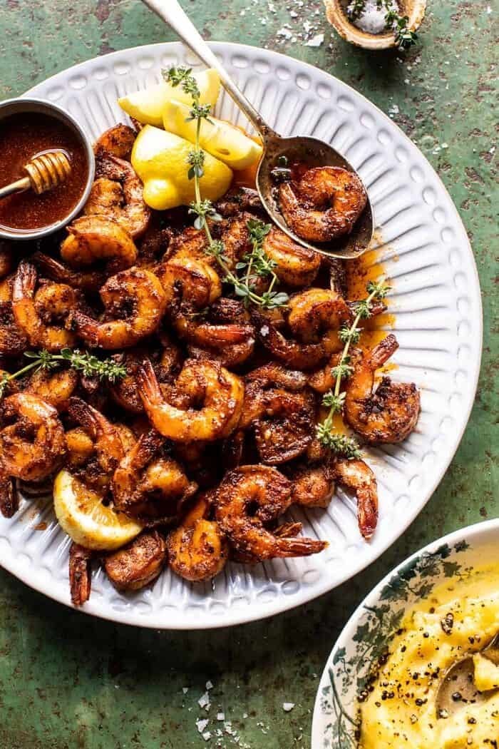 15 Minute Cajun Hot Honey Butter Shrimp | halfbakedharvest.com overhead photo of 15 Minute Cajun Hot Honey Butter Shrimp on serving plate with spoon