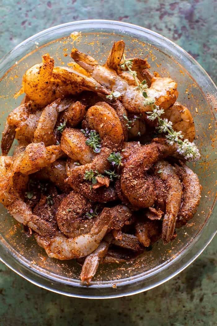 15 Minute Cajun Hot Honey Butter Shrimp | halfbakedharvest.com raw seasoned shrimp in bowl before cooking