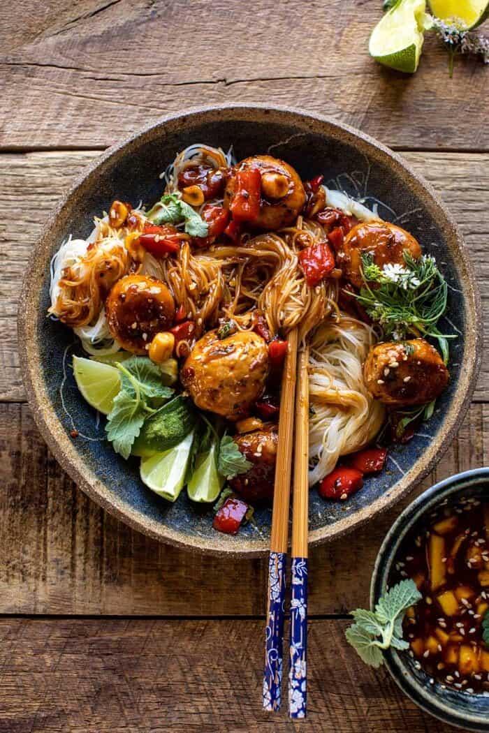 30 Minute Sticky Thai Meatballs with Sesame Noodles | halfbakedharvest.com overhead photo of 30 Minute Sticky Thai Meatballs with Sesame Noodles with chopsticks in bowl