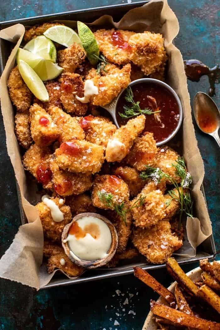 Coconut Popcorn Chicken with Sweet Thai Chili Lime Sauce | halfbakedharvest.com overhead close up photo of Coconut Popcorn Chicken with Sweet Thai Chili Lime Sauce