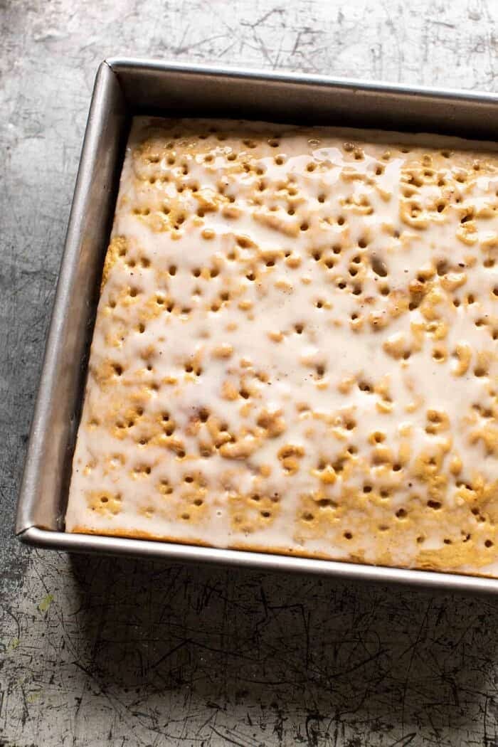 Dirty Horchata Tres Leches Cake | halfbakedharvest.com prep photo of Dirty Horchata Tres Leches Cake soaking in milk