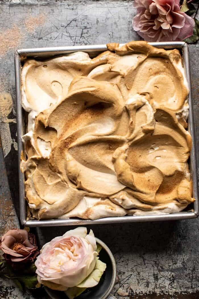 Dirty Horchata Tres Leches Cake | halfbakedharvest.com overhead photo of Dirty Horchata Tres Leches Cake in pan with whipped cream