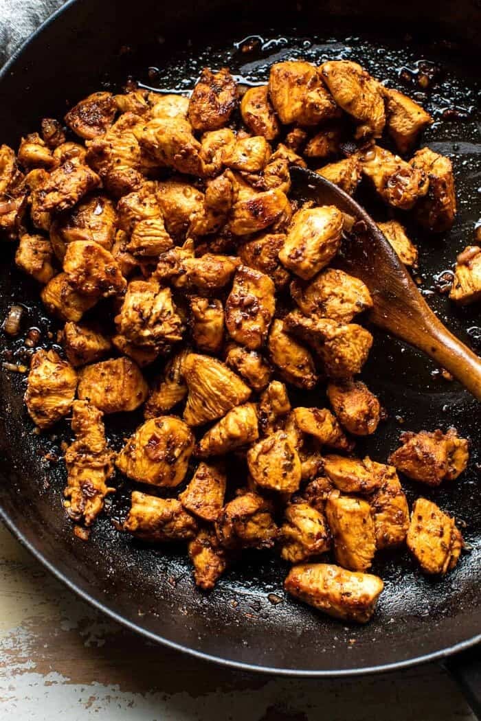 Greek Chicken Chopped Salad with Lemon Tahini Vinaigrette | halfbakedharvest.com overhead prep photo of Greek Chicken in skillet after cooking
