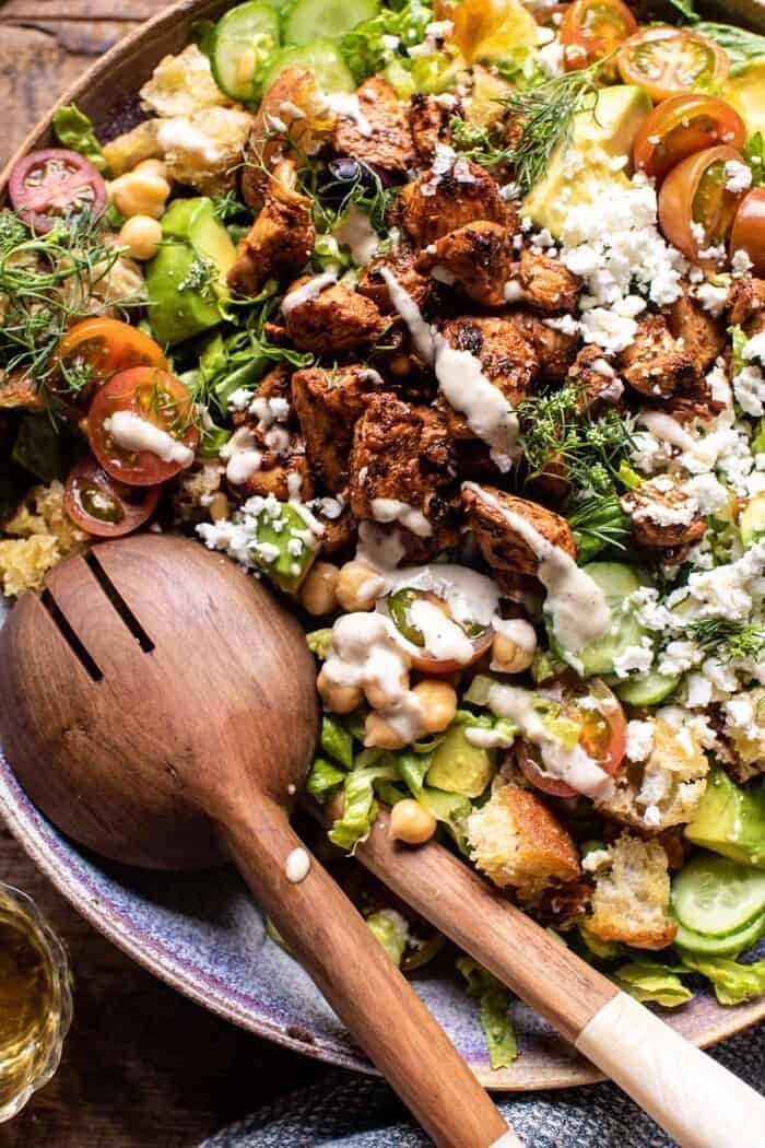 Greek Chicken Chopped Salad with Lemon Tahini Vinaigrette | halfbakedharvest.com overhead close up photo of Greek Chicken Chopped Salad with Lemon Tahini Vinaigrette