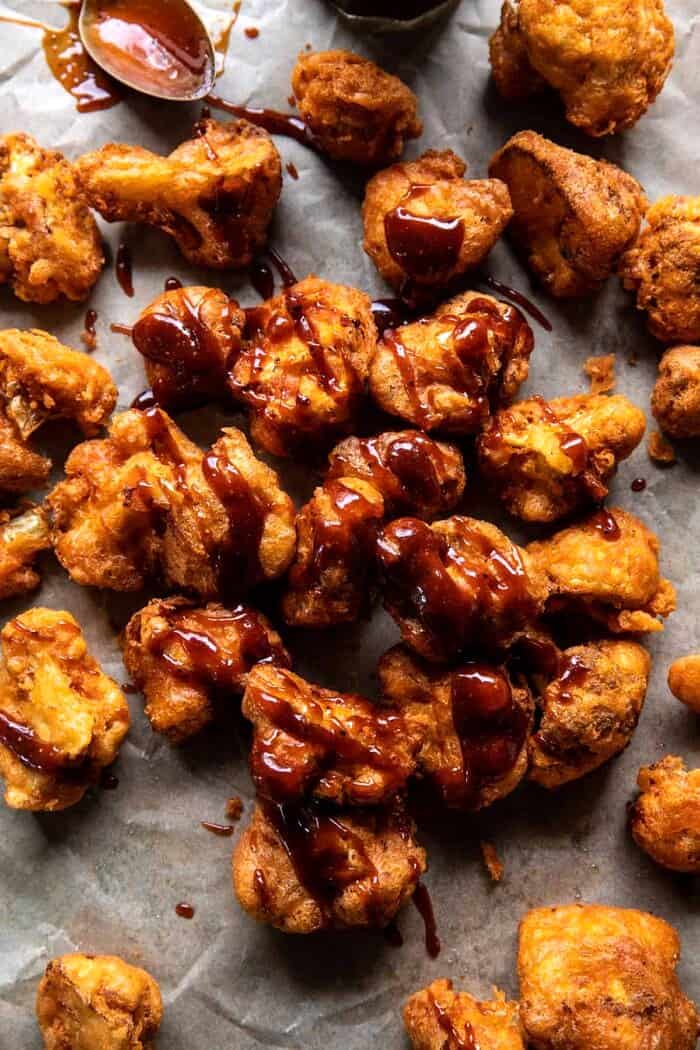 Crispy Beer Battered BBQ Cauliflower Nuggets | halfbakedharvest.com overhead photo of Crispy Beer Battered BBQ Cauliflower Nuggets after adding sauce