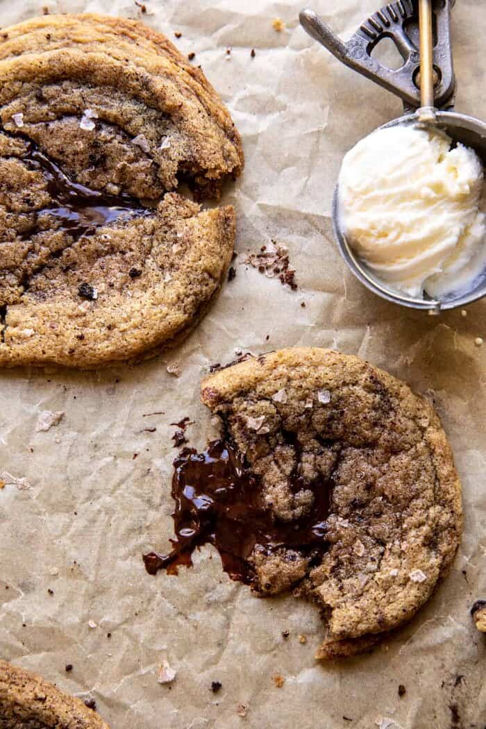 Giant Salted Espresso Hot Fudge Cookies | halfbakedharvest.com overhead photo of Giant Salted Espresso Hot Fudge Cookie broken in half