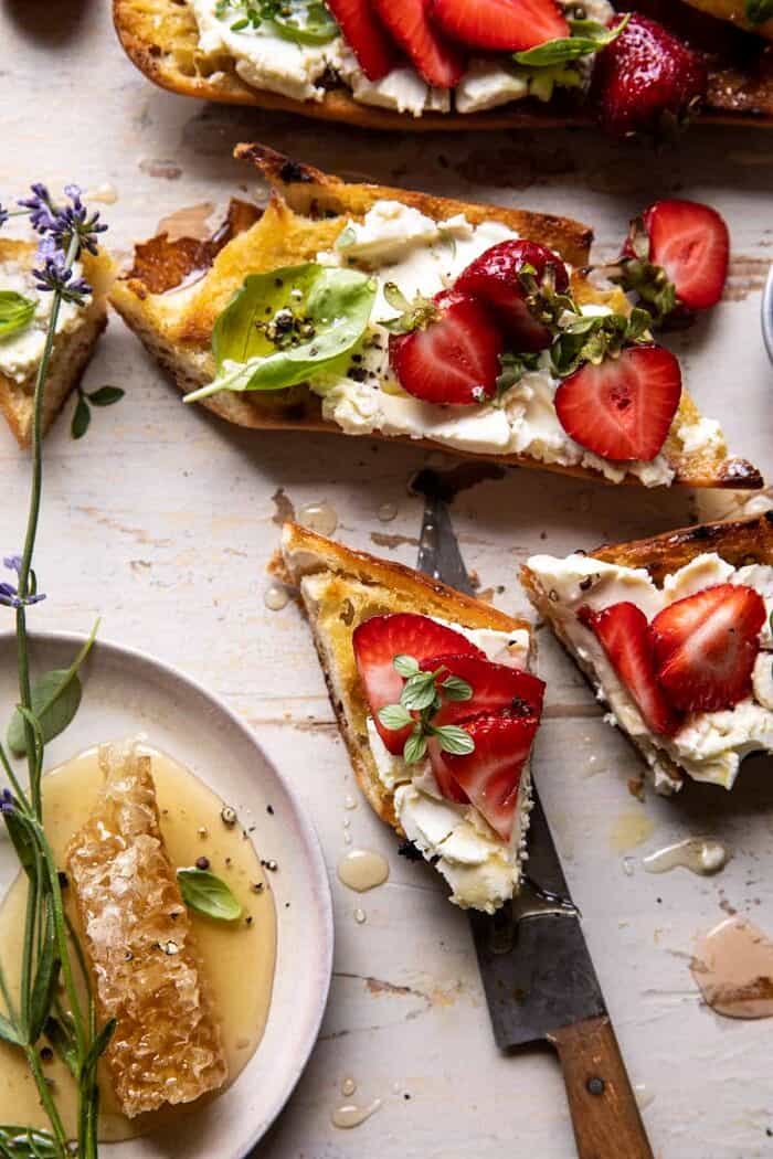 overhead photo of Marinated Goat Cheese Strawberry Crostini cut in half