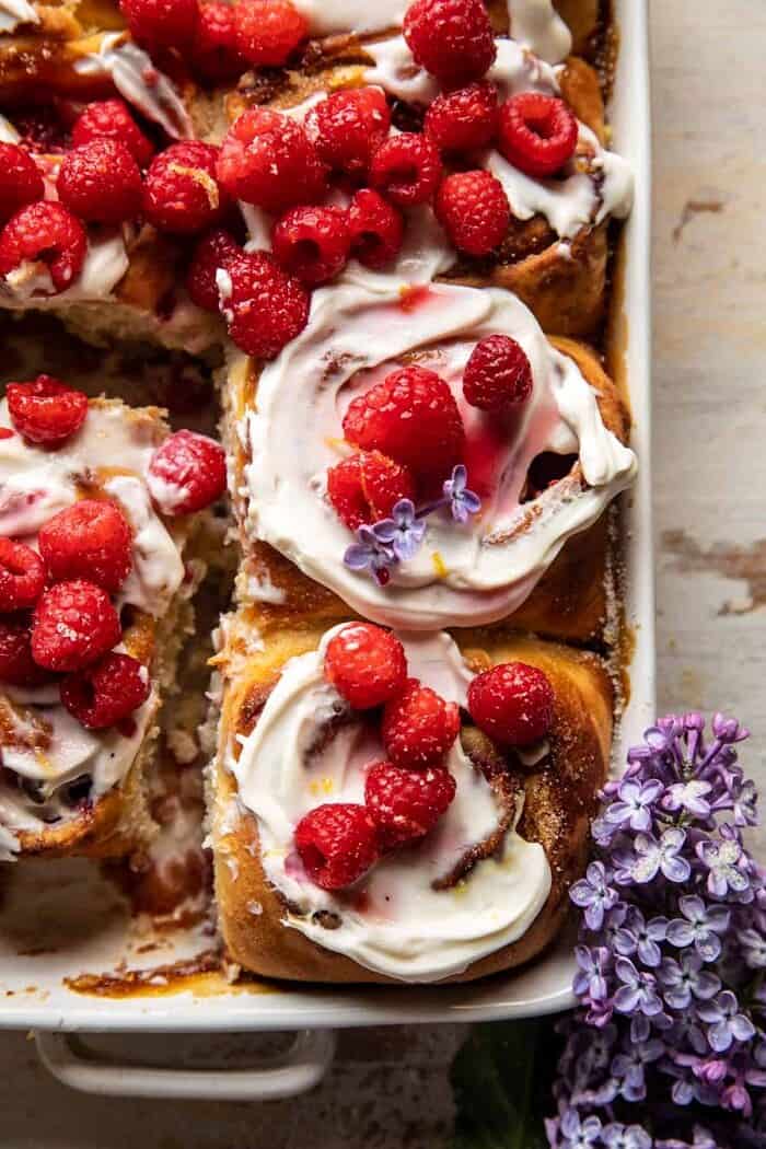 Raspberry Lemon Brioche Rolls with Whipped Ricotta Cream | halfbakedharvest.com overhead close up photo of Raspberry Lemon Brioche Rolls with Whipped Ricotta Cream in baking dish