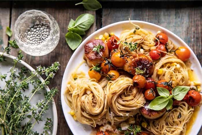 overhead horizontal photo of Browned Butter Scallops and Burst Tomato Basil Pasta 