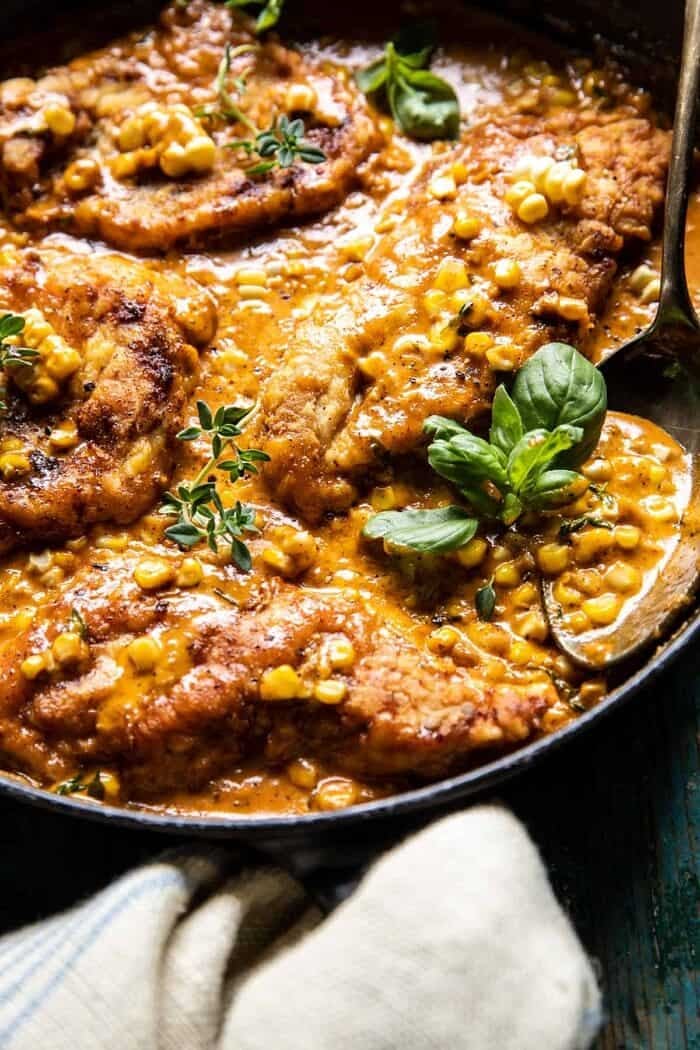 Creamy Cajun Skillet Chicken Lazone with Herby Corn | halfbakedharvest.com side angle photo of Creamy Cajun Skillet Chicken Lazone with Herby Corn