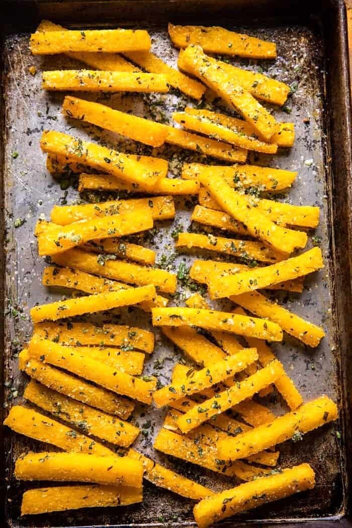 Garlic Parmesan Herb Butter Polenta Fries on baking sheet after baking
