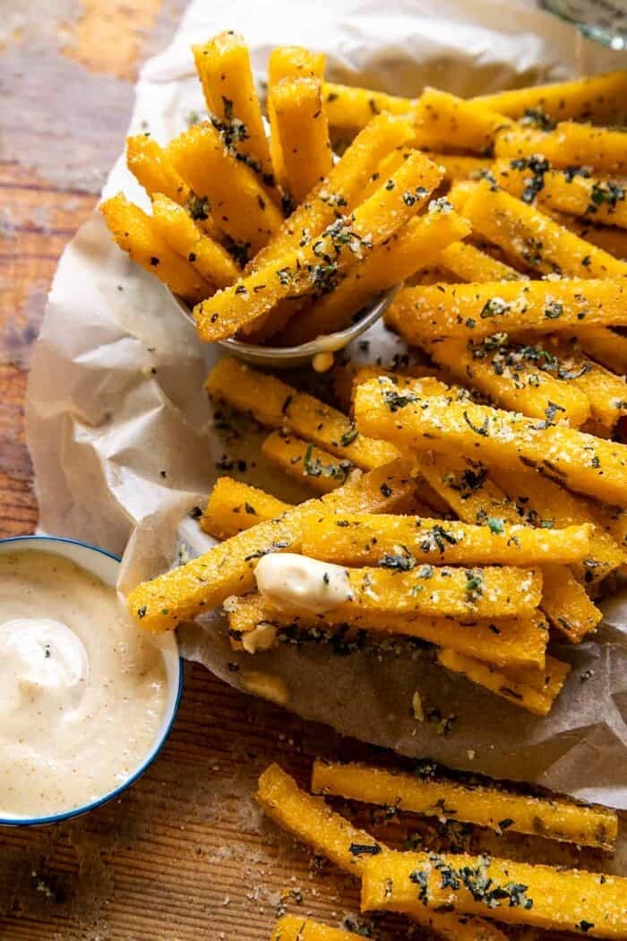 close up photo of Garlic Parmesan Herb Butter Polenta Fries with Lemon Aioli 