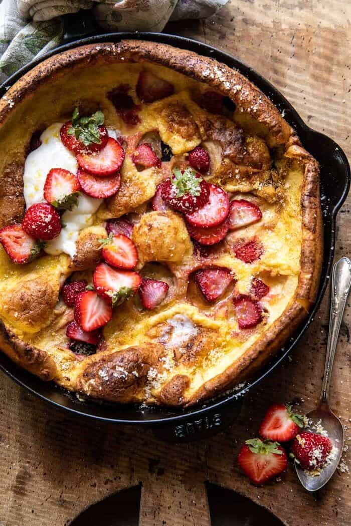 overhead photo of Lemon Strawberry Dutch Baby with Ricotta Cream