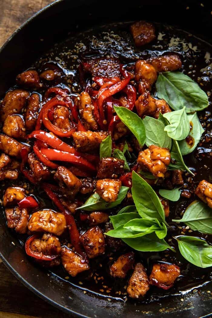 Thai Basil Sesame Cashew Chicken with Coconut Rice | halfbakedharvest.com overhead photo of Thai Basil Sesame Cashew Chicken in skillet
