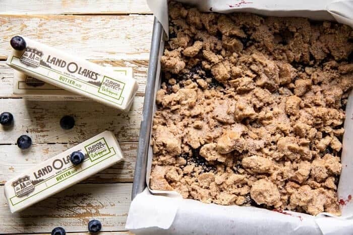 Cinnamon Sugar Blueberry Crumb Bars | halfbakedbarvest.com overhead prep photo of Cinnamon Sugar Blueberry Crumb Bars before baking