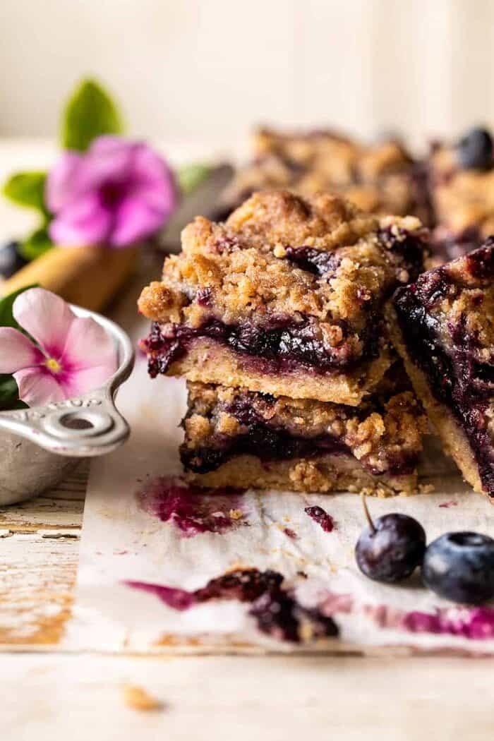 Cinnamon Sugar Blueberry Crumb Bars | halfbakedbarvest.com front on photo of Cinnamon Sugar Blueberry Crumb Bars