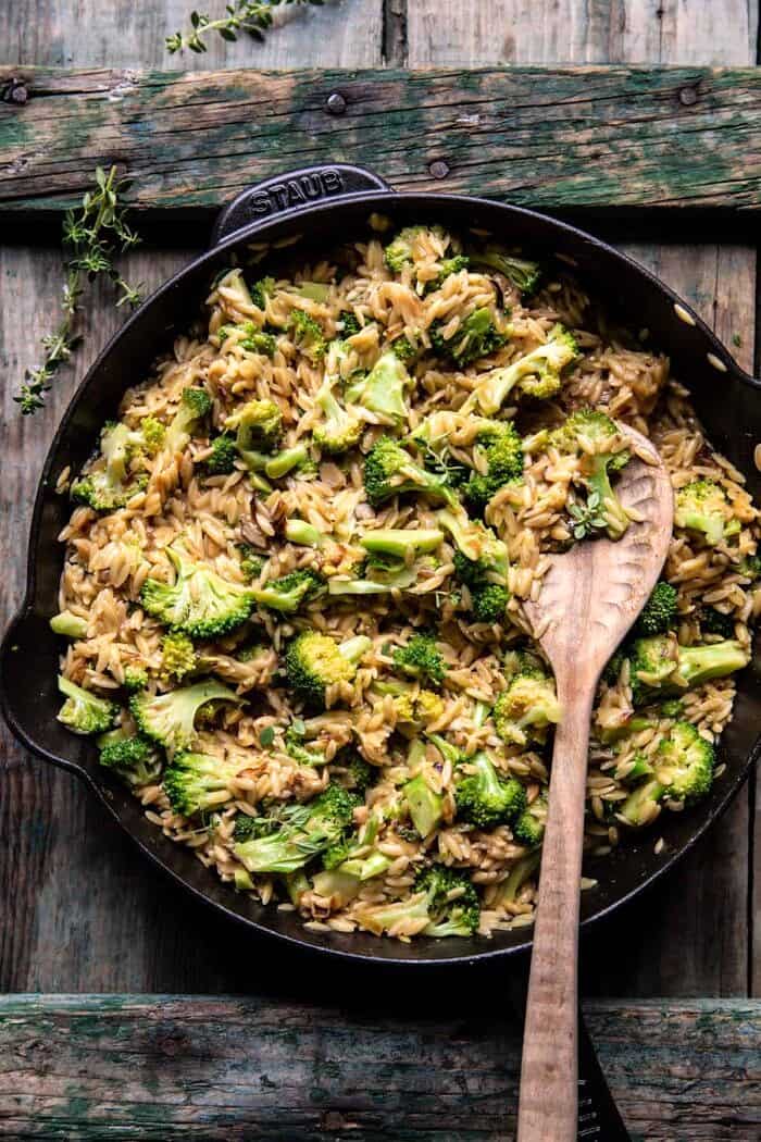One Skillet Cheesy Broccoli Cheddar Orzo Bake | halfbakedharvest.com process photo of Cheesy Broccoli Cheddar Orzo in skillet before adding cheese and before baking