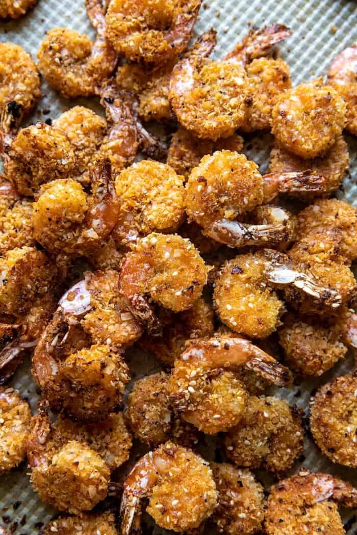 Oven Fried Coconut Shrimp with Thai Pineapple Chili Sauce | halfbakedhavest.com overhead photo of Oven Fried Coconut Shrimp on baking sheet