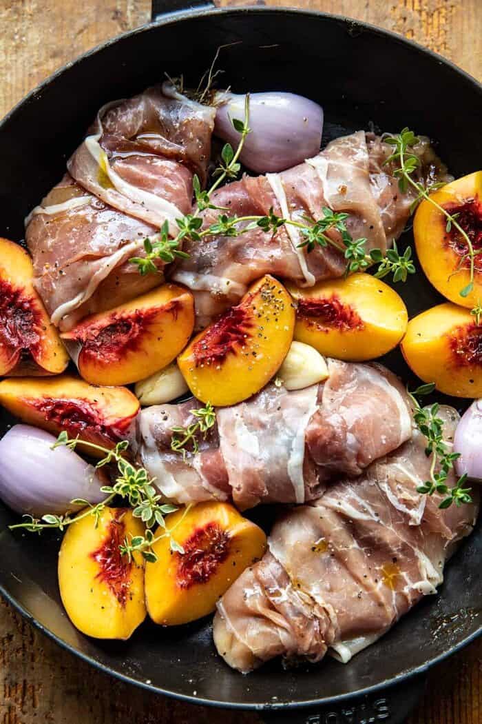 Prosciutto Balsamic Peach Chicken with Burrata and Basil | halfbakedharvest.com overhead photo of Prosciutto Balsamic Peach Chicken in skillet before baking