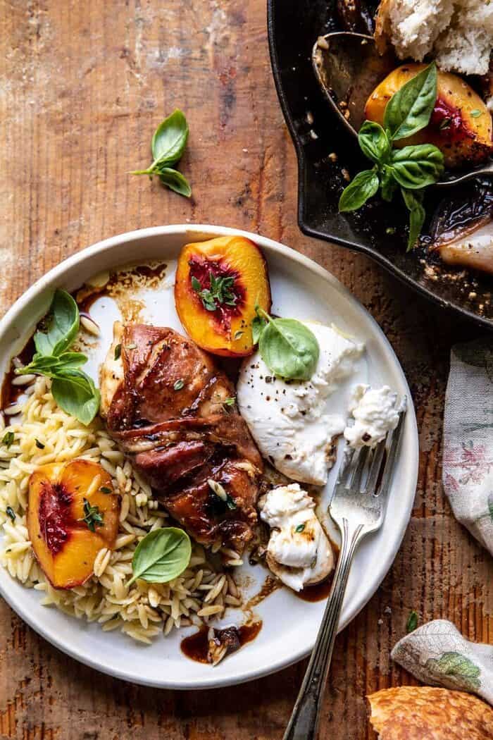Prosciutto Balsamic Peach Chicken with Burrata and Basil | halfbakedharvest.com overhead photo of Prosciutto Balsamic Peach Chicken with Burrata and Basil on plate with orzo