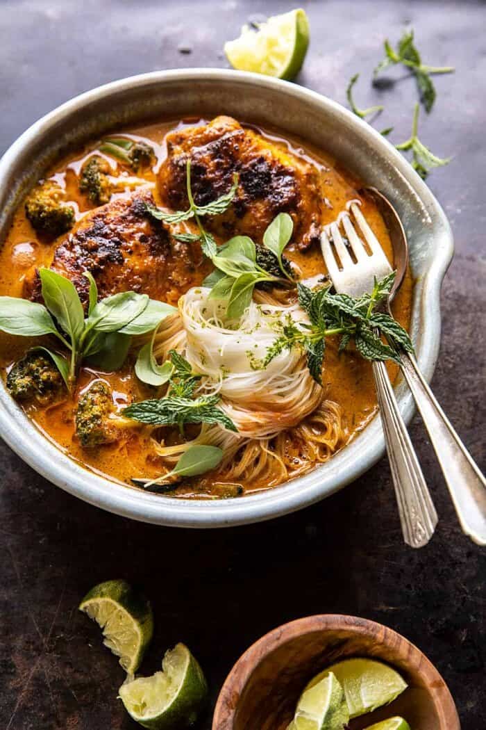 Saucy Coconut Braised Chicken with Rice Noodles and Broccoli | halfbakedharvest.com side angled photo of Saucy Coconut Braised Chicken with Rice Noodles and Broccoli