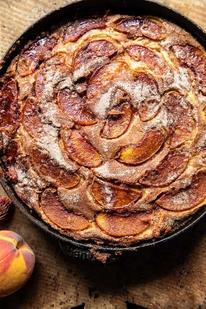 Skillet Cinnamon Sugar Peach Upside Down Cake | halfbakedharvest.com overhead photo of Skillet Cinnamon Sugar Peach Upside Down Cake in skillet