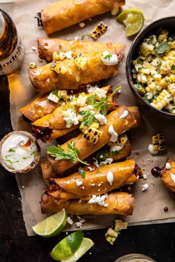 Crockpot BBQ Beer Chicken Taquitos with Street Corn Salsa | halfbakedharvest.com overhead photo of Crockpot BBQ Beer Chicken Taquitos with Street Corn Salsa