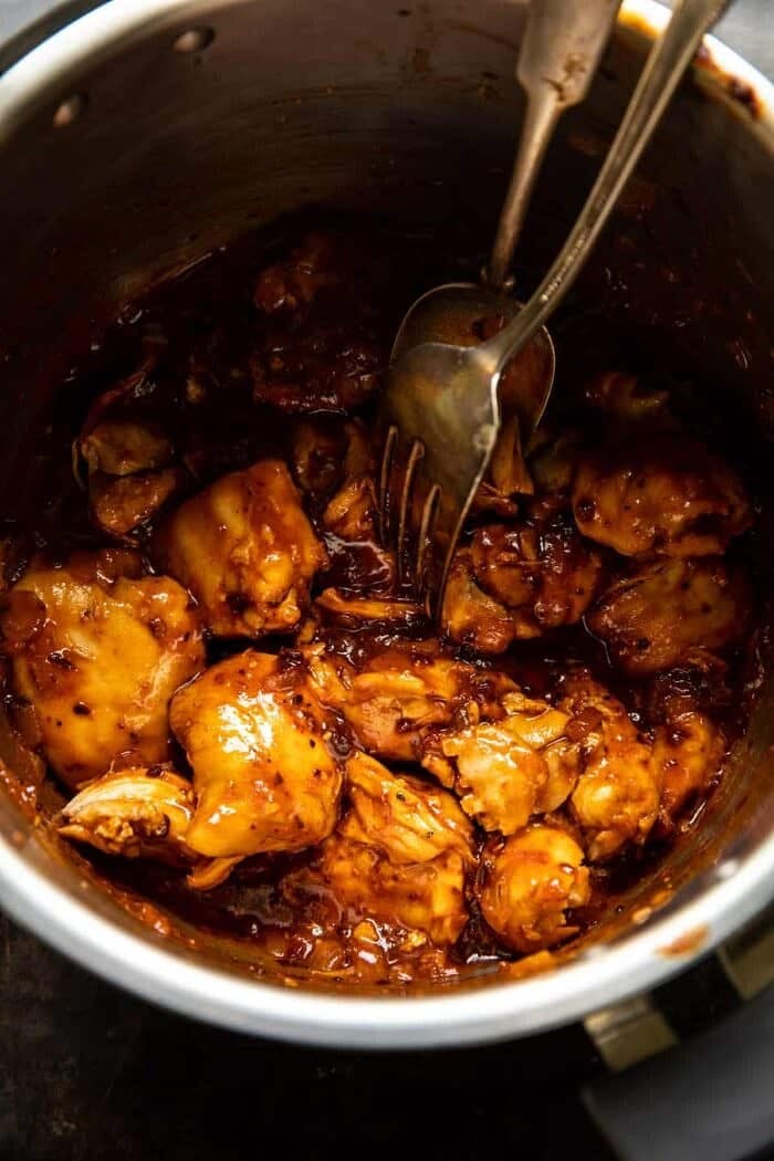 Crockpot BBQ Beer Chicken Taquitos with Street Corn Salsa | halfbakedharvest.com overhead photo of Crockpot BBQ Beer Chicken in crockpot bowl