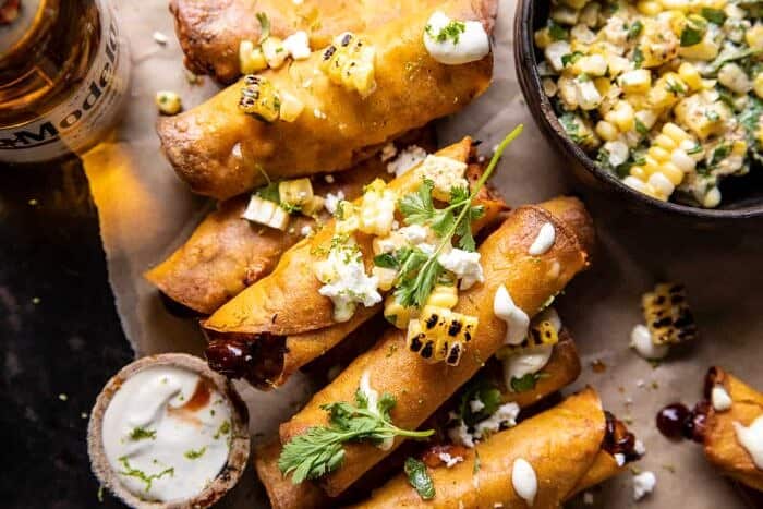 Crockpot BBQ Beer Chicken Taquitos with Street Corn Salsa | halfbakedharvest.com overhead horizontal photo of Crockpot BBQ Beer Chicken Taquitos with Street Corn Salsa