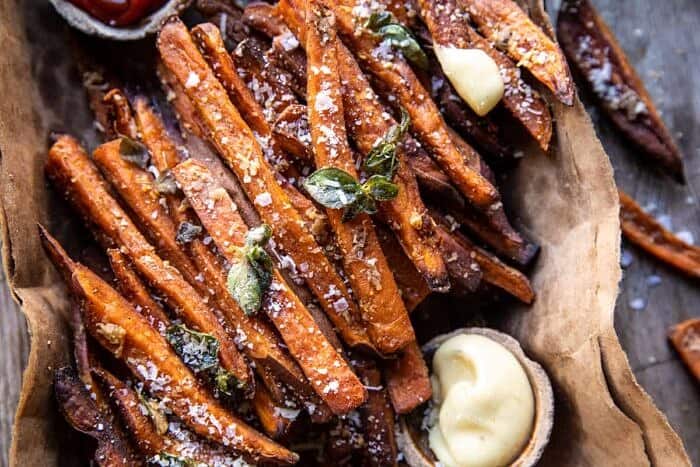 overhead horizontal photo of Garlic Parmesan Sweet Potato Fries with Spicy Aioli