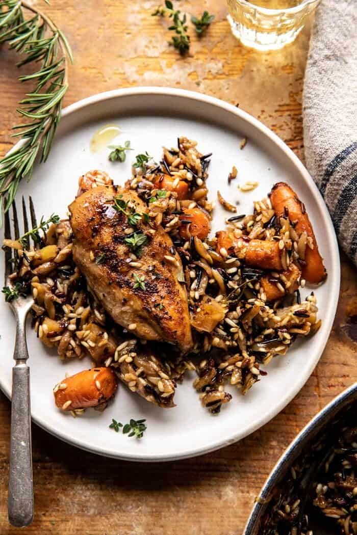 One Pot Lemon Rosemary Dijon Chicken and Butter Toasted Rice Pilaf | halfbakedharvest.com over head photo of One Pot Lemon Rosemary Dijon Chicken and Butter Toasted Rice Pilaf on dinner plate with fork
