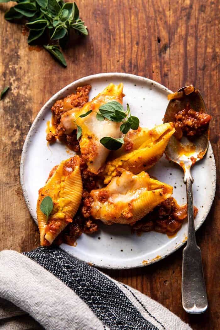 Pumpkin Cheese Stuffed Pasta Bolognese Bake | halfbakedharvest.com overhead photo of Pumpkin Cheese Stuffed Pasta Bolognese Bake on dinner plate