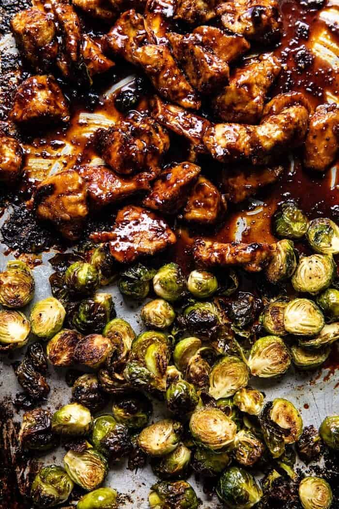 Sheet Pan Sticky Ginger Sesame Chicken and Crispy Brussels Sprouts | halfbakedharvest.com overhead prep photo of Sheet Pan Sticky Ginger Sesame Chicken and Crispy Brussels Sprouts after baking on baking sheet