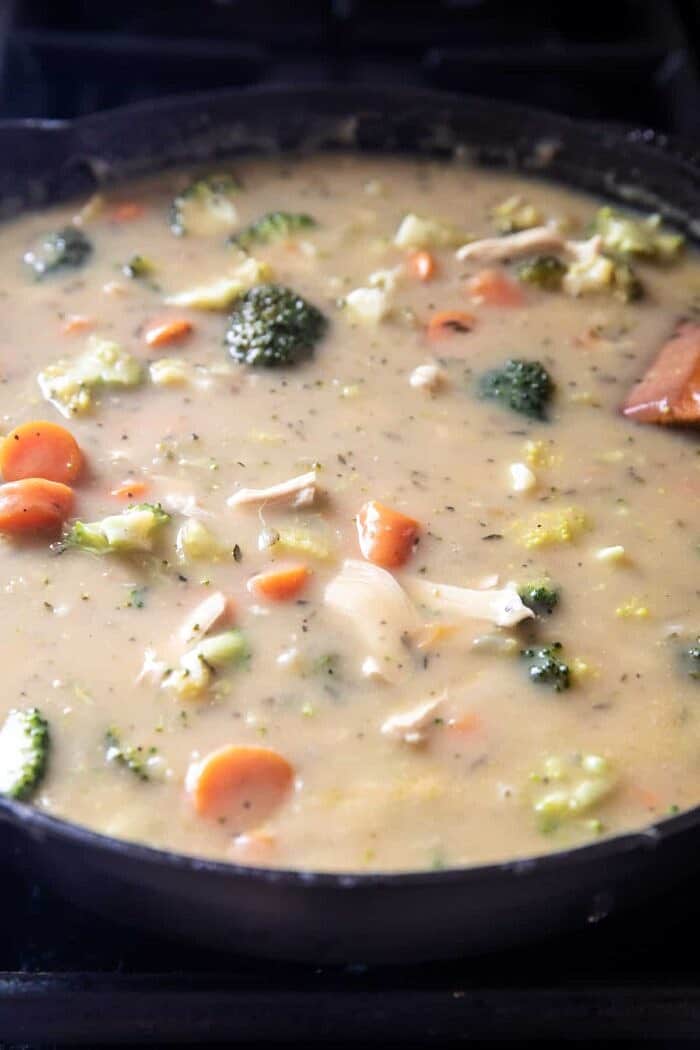 Skillet Chicken Broccoli Pot Pie with Garlic Butter Phyllo Crust | halfbakedharvest.com prep photo of Skillet Chicken Broccoli Pot Pie cooking in skillet on the stove