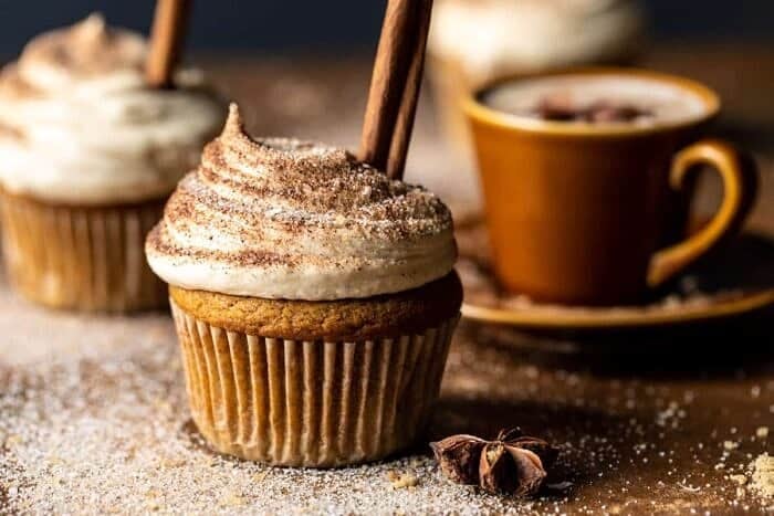 Vanilla Chai Pumpkin Latte Cupcakes with Cinnamon Brown Sugar Frosting | halfbakedhavest.com side angled photo of Vanilla Chai Pumpkin Latte Cupcakes with Cinnamon Brown Sugar Frosting
