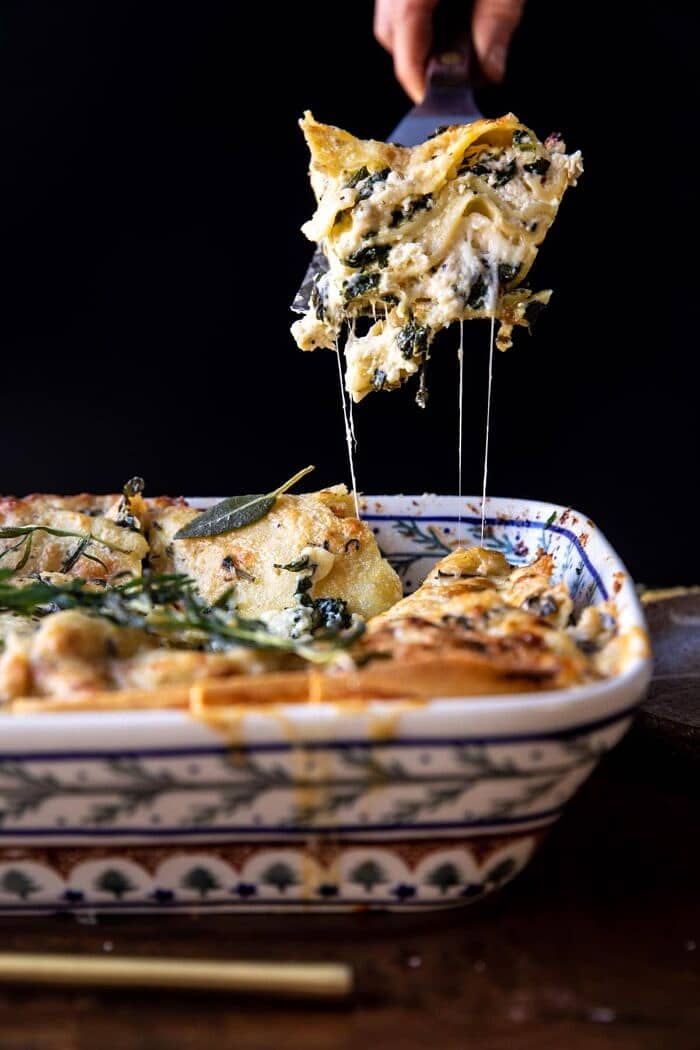 4 Cheese Sage Pesto Florentine Lasagna | halfbakedharvest.com side angled photo of 4 Cheese Sage Pesto Florentine Lasagna
