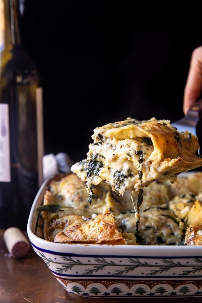 4 Cheese Sage Pesto Florentine Lasagna | halfbakedharvest.com side angled photo of 4 Cheese Sage Pesto Florentine Lasagna