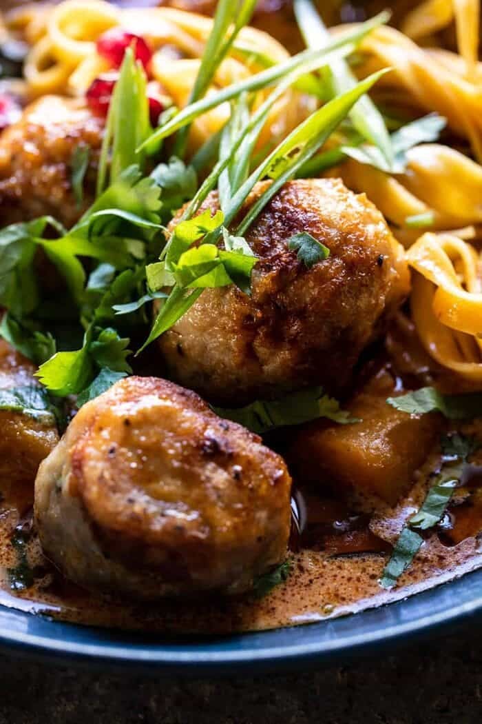 Creamy Coconut Chicken Meatball and Noodle Curry | halfbakedharvest.com side angled close Creamy Coconut Chicken Meatball and Noodle Curry