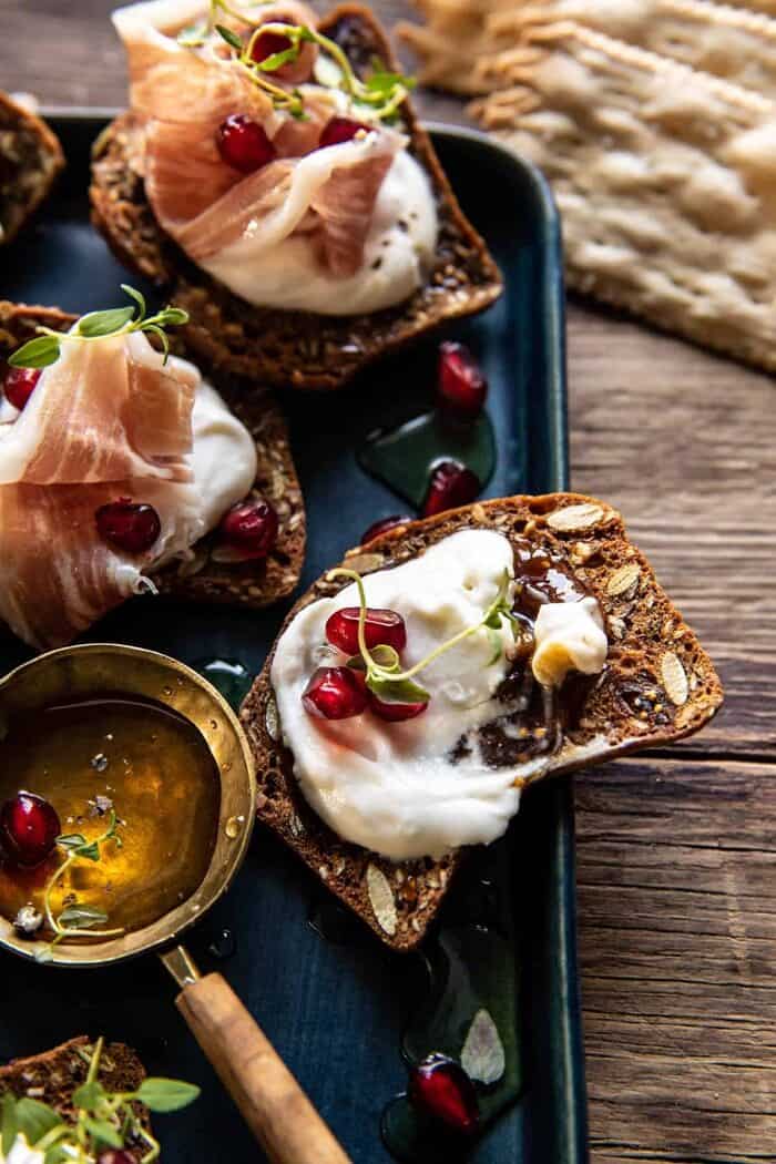 Honey Whipped Ricotta and Prosciutto Crackers | halfbakedharvest.com overhead close up photo of Honey Whipped Ricotta and Prosciutto Crackers