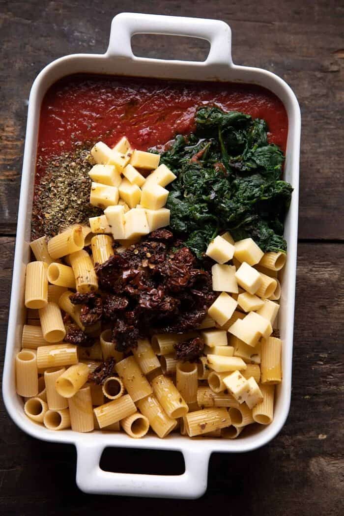 One Pan 4 Cheese Sun-Dried Tomato and Spinach Pasta Bake | halfbakedharvest.com overhead prep photo of One Pan 4 Cheese Sun-Dried Tomato and Spinach Pasta Bake before baking