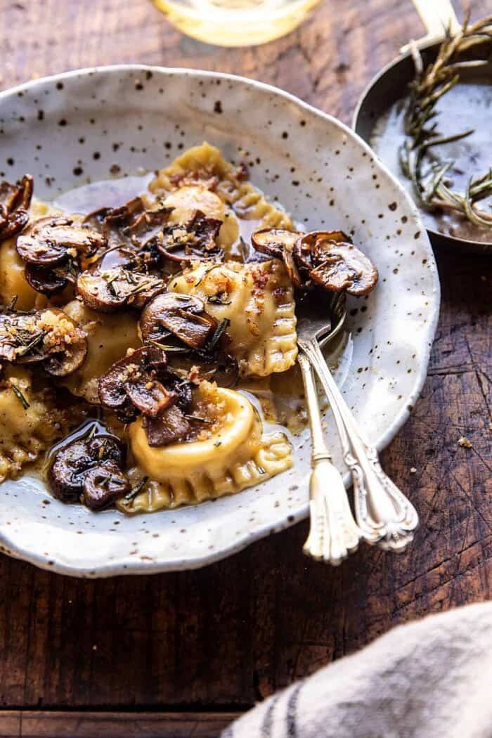 Rosemary Butter Mushroom and Cheese Ravioli | halfbakedharvest.com side angled photo of Rosemary Butter Mushroom and Cheese Ravioli